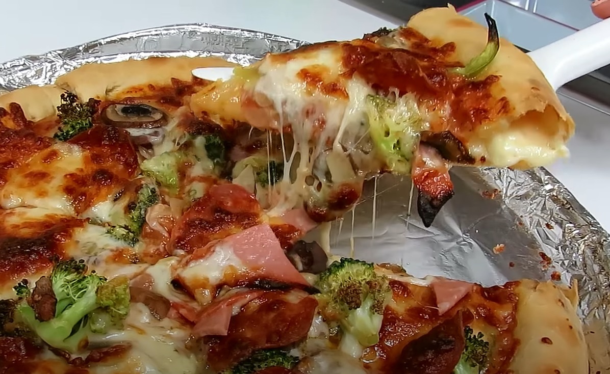imagen de porcion de pizza quesuda